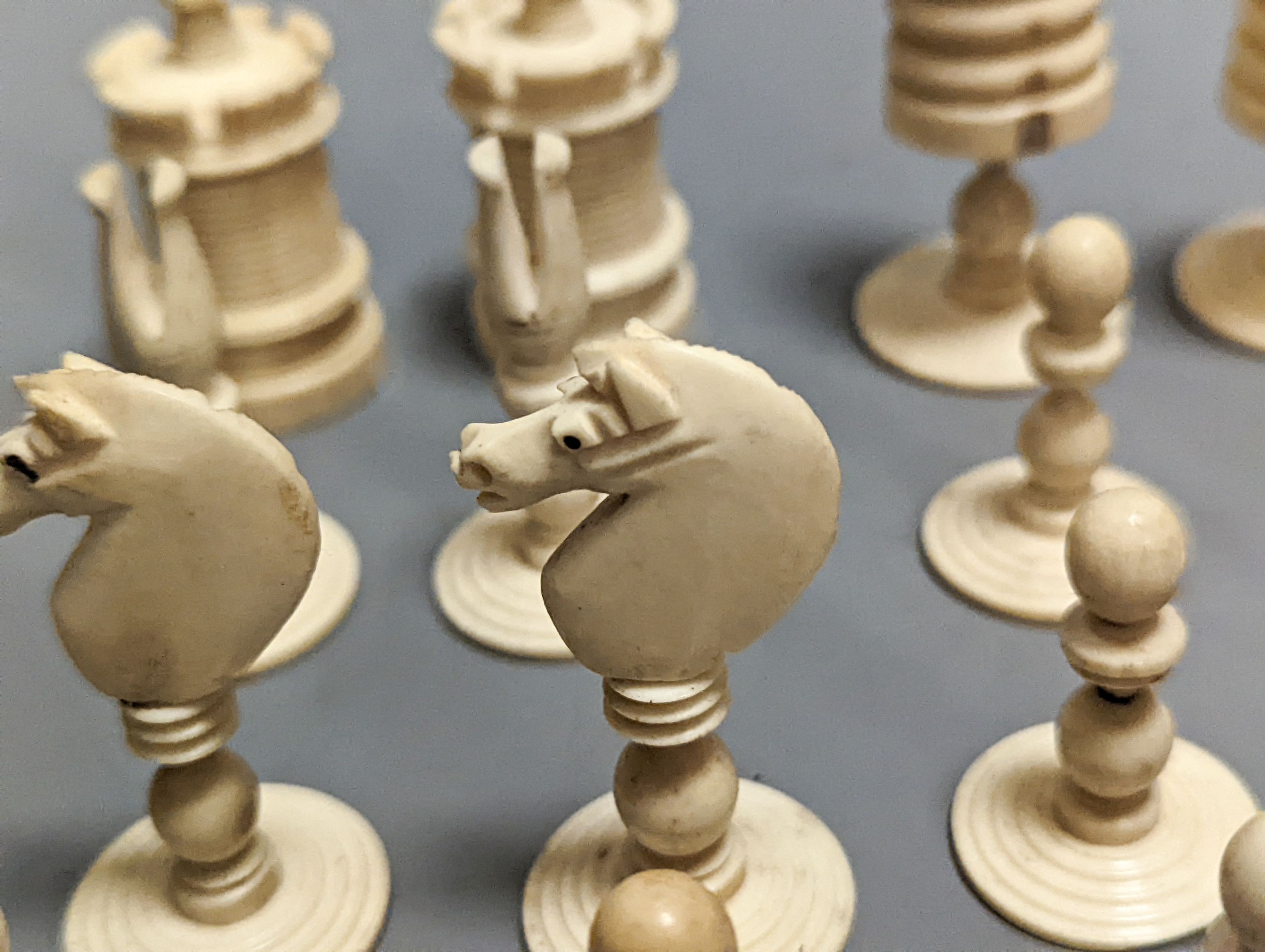 A 19th century turned ivory and bone chess set